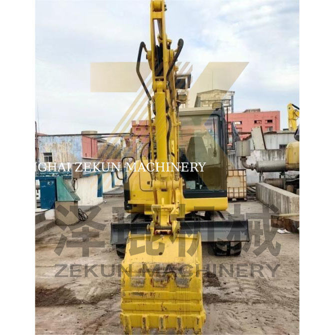 Tweedehands Komatsu PC56 graafmachine met een emmercapaciteit van 0,2 m3 en 0-2000 werkuren